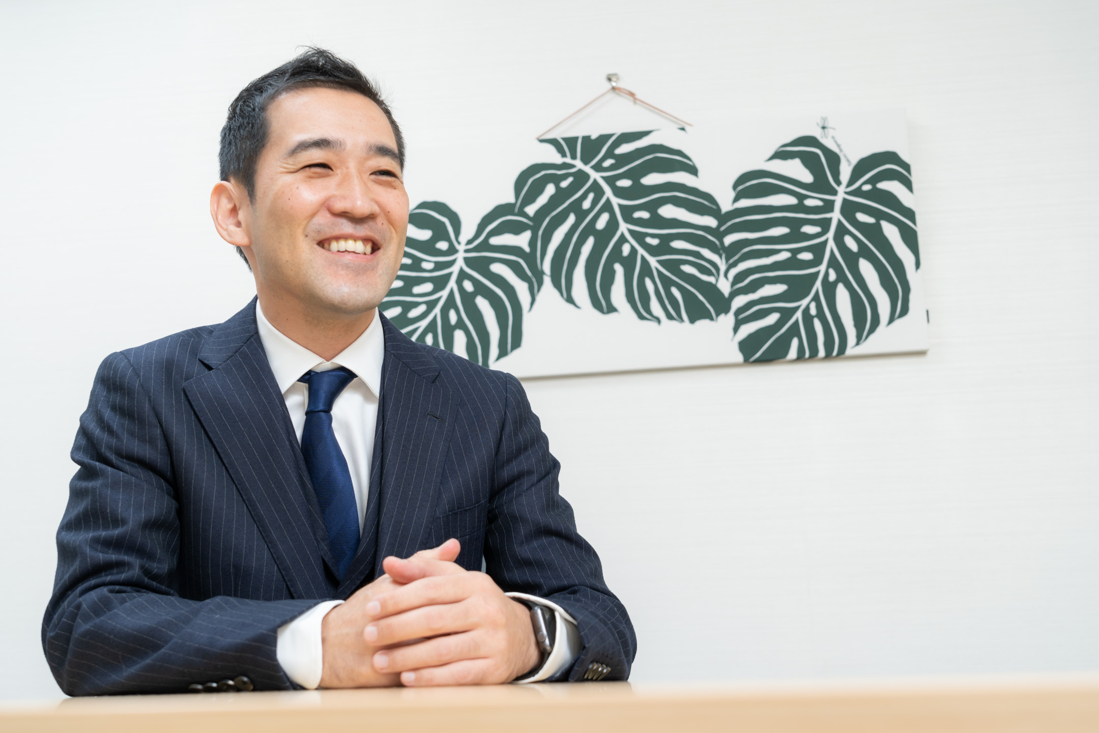 インタビューで説明する川口宏之